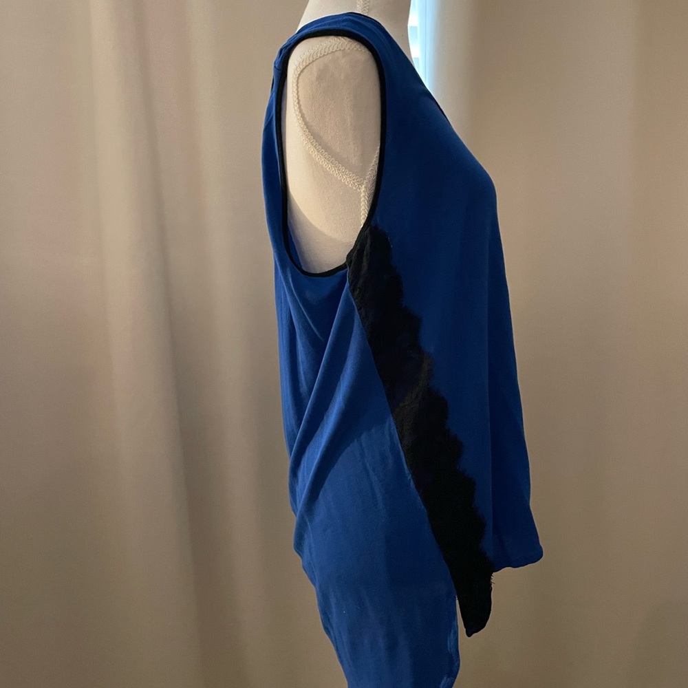 Blue blouse with black lace design